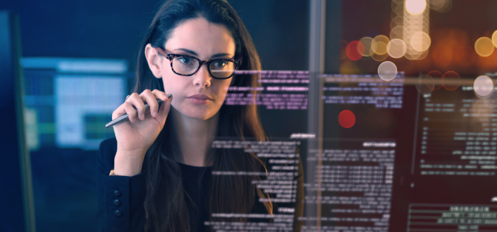 Woman looking at and analyzing data